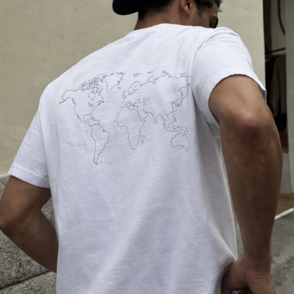 Back view of organic cotton t-shirt with subtle world map graphic