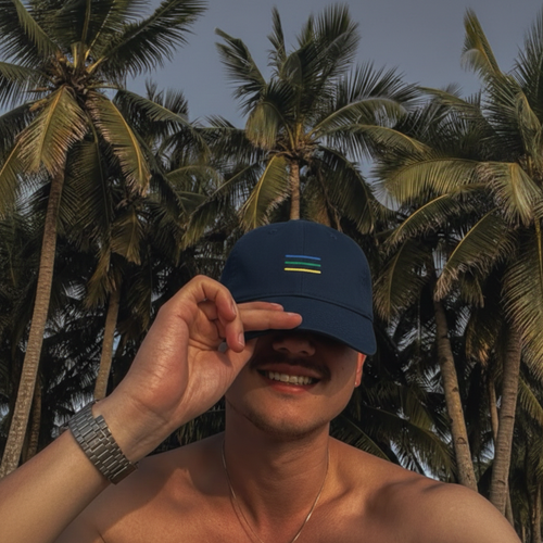 cap with embroidery - man wearing on the beach